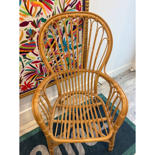A Pair of Rattan Fan Back Lounge Chairs in the Franco Albini's Style. In great condition, would love to see them go to a...