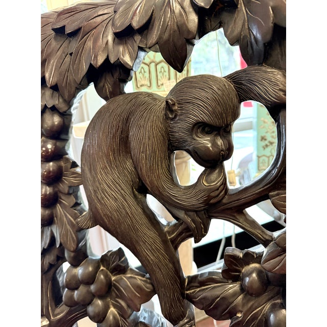 Figural monkey detailing makes this carved Asian arm chair extra special. A conversation piece! Probably made from...