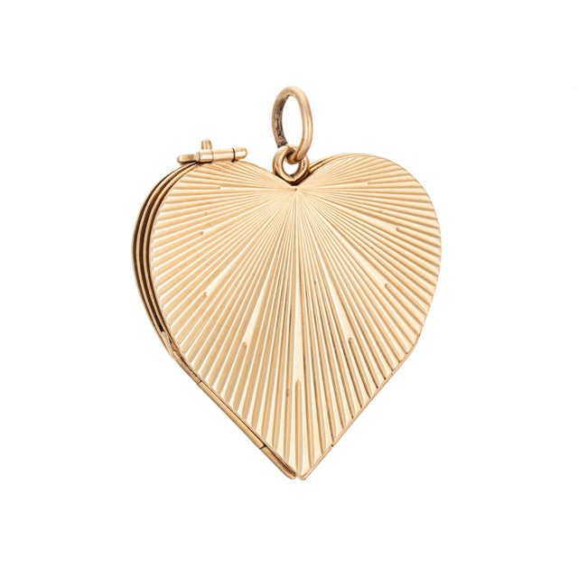 Unique & stylish vintage engine turned heart pendant crafted in 14 karat yellow gold (circa 1950s). This vintage 14k gold...