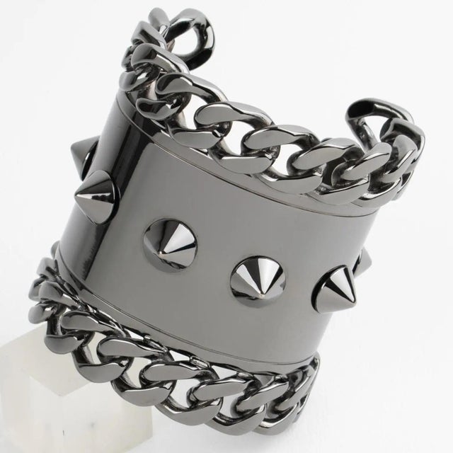 Make a bold statement with this exceptional Givenchy Paris bangle bracelet, a rare and striking example of brutalist...