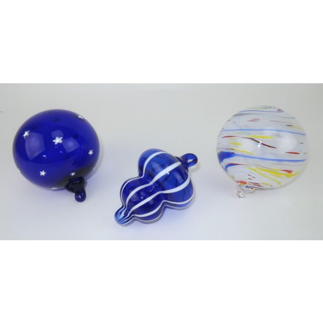 Deck the hall with artist made ornaments including one by renowned art glass studio, Thames Glass in Newport Rhode Island....