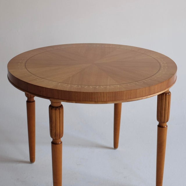 Swedish Modern Veneered Centre table from circa 1950s. Beautiful neo classic design around the edges in sycamore and...
