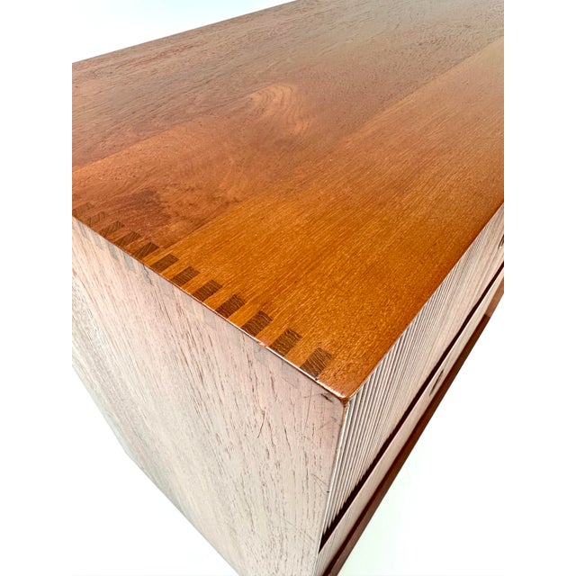 1960's cabinet designed by Peter Hvidt & Orla Mølgaard-Nielsen for Søborg Møbelfabrik. Two level tambour doors conceal...