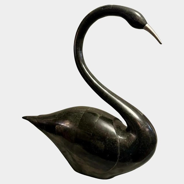A large tessellated marble stylised swan by Maitland Smith. The black marble used to cover the body with hints of grey....