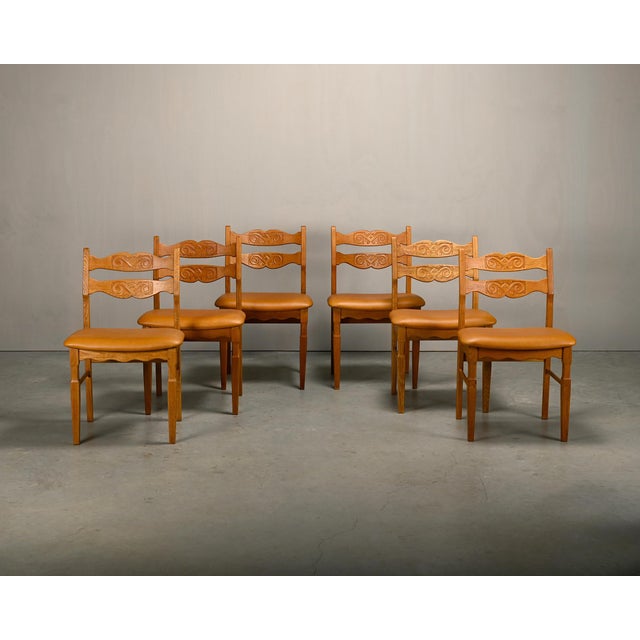 Set of 6 or 7 vintage mid-century 'Razorblade' style dining chairs, designed by Henning Kjærnulf and manufactured by EG...