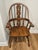 The Windsor chair is a style of chair that originated in England in the early 18th century and became popular in America...