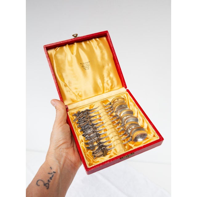 Set of 12 Swedish silver teaspoons in their original case. All of them bear the 830 mark, the three crowns indicating that...