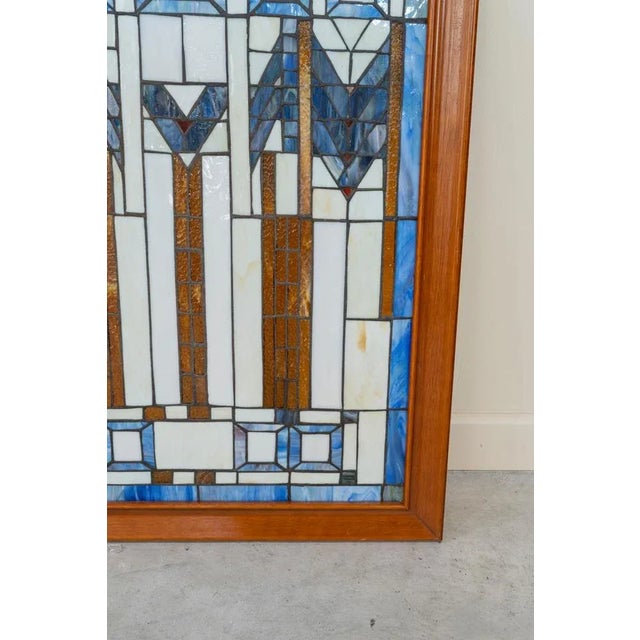 Modernist rectangular stained glass windows, with wooden frame. Geometric design with equal pattern in flat and marble...