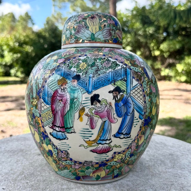 A beautifully detailed vintage Chinese ginger jar featuring intricate hand-painted decoration in a rich palette of pastel...