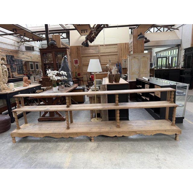 This incredible vintage florist's display shelf has been fully restored. Its raw oak finish is a testament to its past...