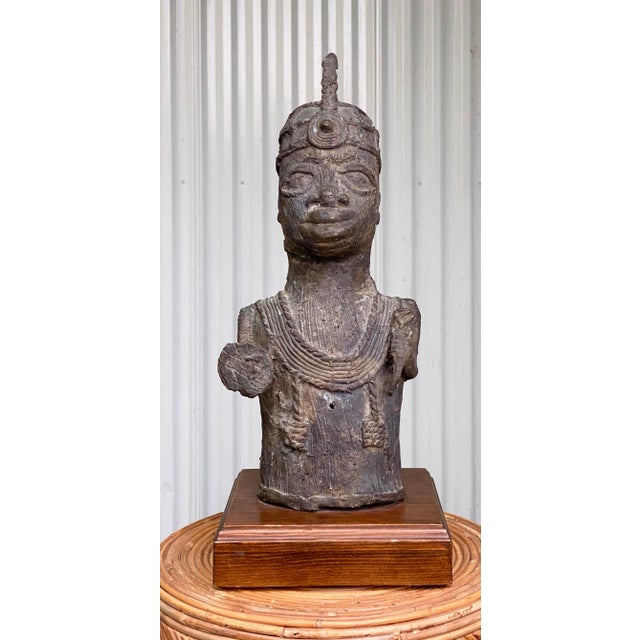 This Mid 20th Century Vintage Bronze Tribal Sculpture is a striking piece that beautifully captures the essence of...