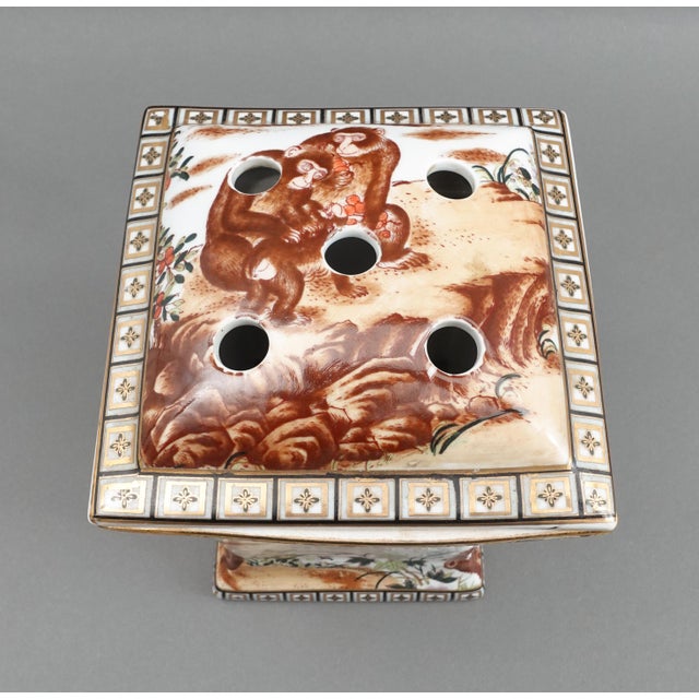 Chinese Hand Painted Monkeys Gold Handled Porcelain Bough Pot Vase. Measures approximately 7" long, 8 1/4" wide handle to...