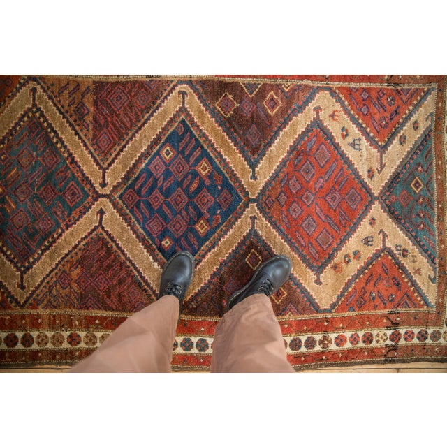 :: Single column center medallion with reciprocating splayed halved medallions, all with arrowed finials and intricate...