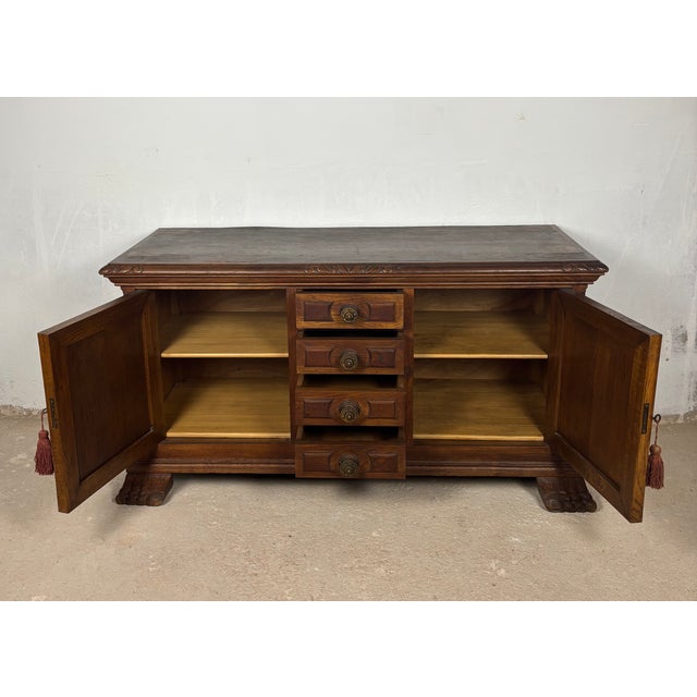 Impressive Spanish low sideboard crafted in oak, dating from the early 20th century and inspired by traditional...