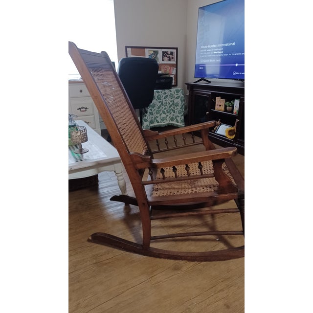 Late 19th century wooden rocking chair, presumably oak and wicker. The seat will need recanning, otherwise very sturdy....