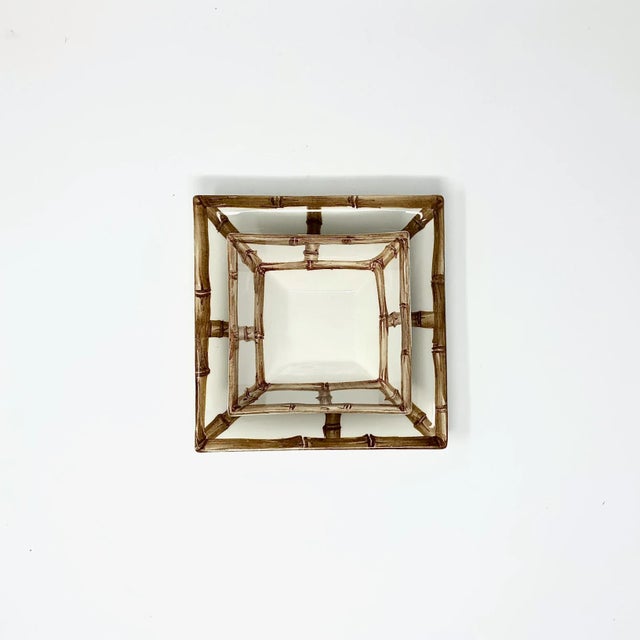 Elevate your everyday with this versatile square catchall tray, framed in a classic bamboo fret motif. Handcrafted in...