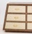 Modern Mahogany Trapezoidal Dresser, with nine tan leather drawers and brass hardware. 36" H x 83.5" W x 20" D....