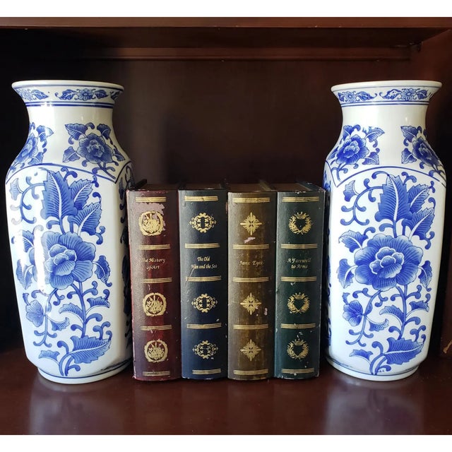 An impressive pair of large vintage Chinese export porcelain vases. These stately pieces feature a traditional hexagonal...