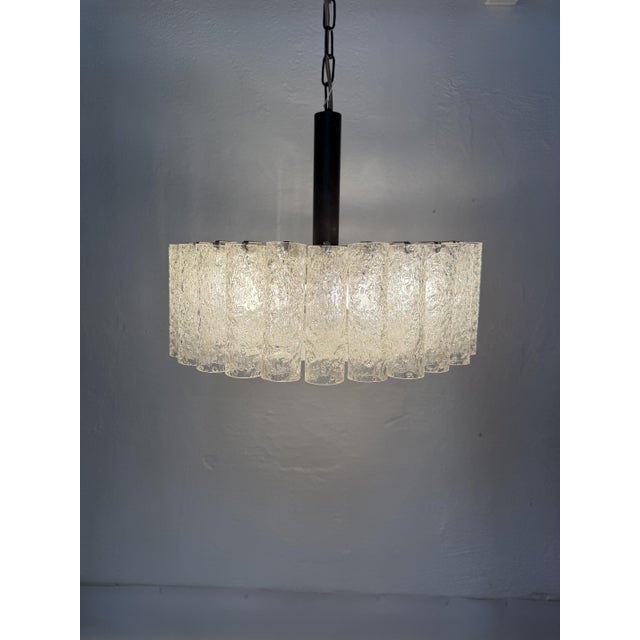 Original doria leuchten chandelier from the 1970s, featuring the distinctive thick, textured glass cylinders...
