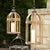Elevate your home decor with this stylish set of Open Wood Lanterns featuring glass hurricanes. Perfect for adding a...