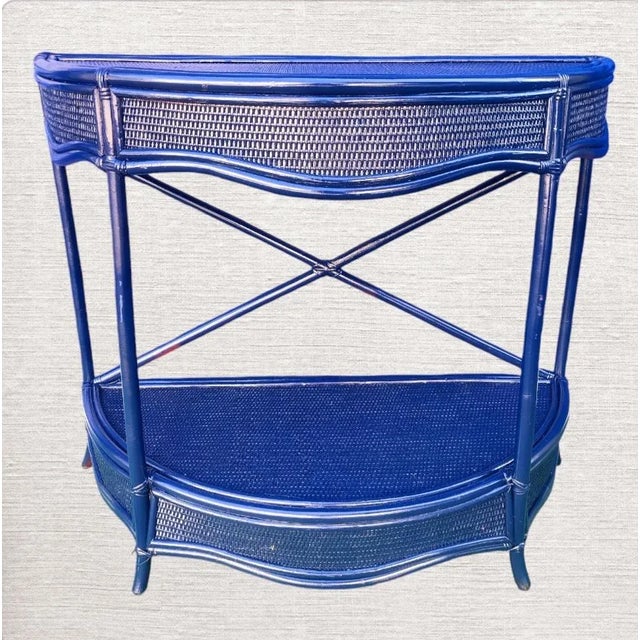 A beautiful navy blue weaved wicker and bamboo demi lune or half moon hall console table. The table has been freshly...