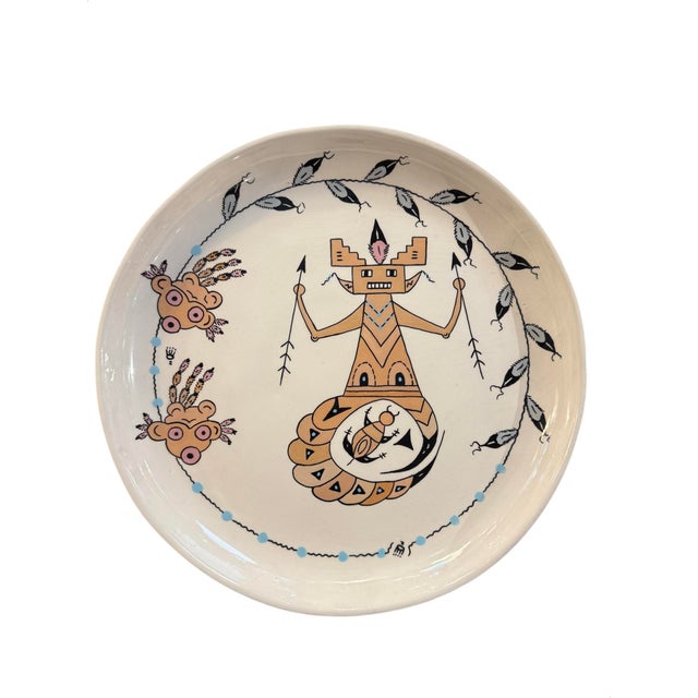 Elevate your dining experience with this exquisite set of four tableware pieces by renowned ceramic artist Genevieve...