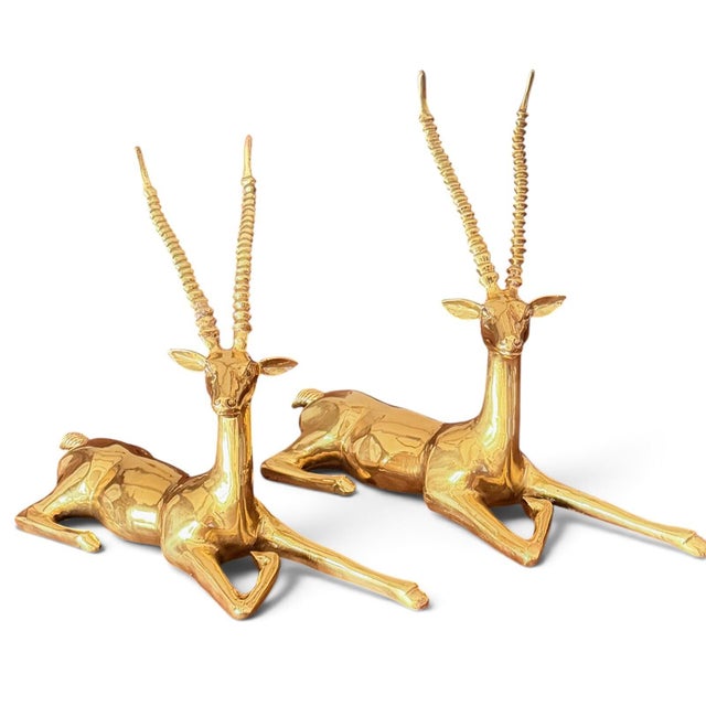 At roughly 18 inches long and more than a foot tall each, this matching pair of vintage Ethan Allen gazelles has the scale...