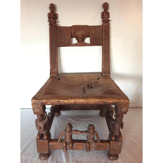 Offered is a fine Chokwe cultural treasure, the chair features upper strut figures of high relief stylized ancestral...