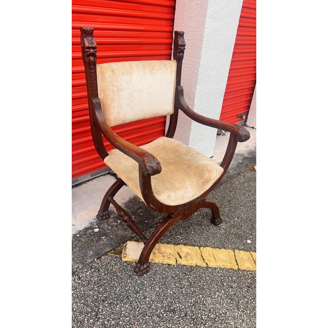 The Italian Renaissance-style "Savonarola" armchair is known for its elegant, folding X-shaped frame, often crafted from...