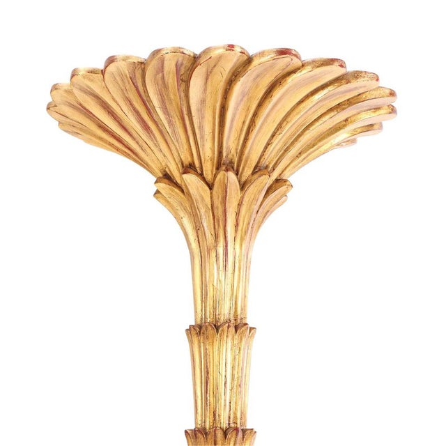 A pair of Serge Roche style giltwood torchieres, characterized by a sculptural, theatrical presence and French...