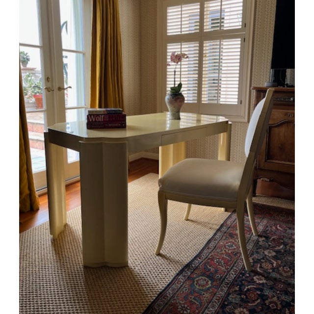 Striking sculptural postmodern desk with matching chair upholstered in cream cotton canvas. Plastered wood is finished in...