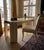 Striking sculptural postmodern desk with matching chair upholstered in cream cotton canvas. Plastered wood is finished in...