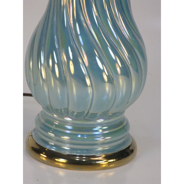 This neoclassical pale blue luster table lamp is made of ceramic & porcelain, featuring a vintage empire design. It is a...