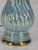 This neoclassical pale blue luster table lamp is made of ceramic & porcelain, featuring a vintage empire design. It is a...