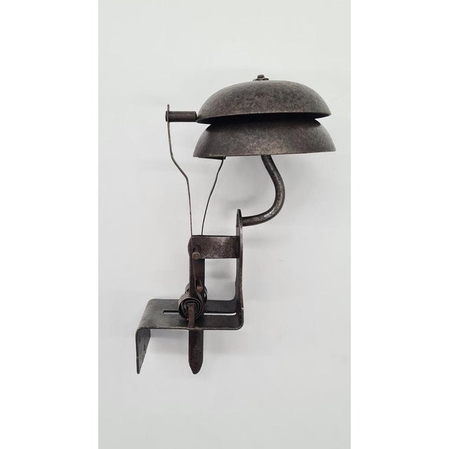 This late 19th-century doorbell, made of wrought steel, represents the subtle Art Nouveau style of French origin. The...