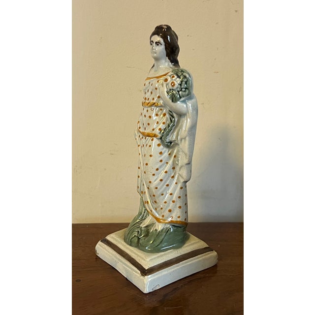 Antique 18th century English George III Staffordshire pearlware four seasons figure depicting summer. She is dressed in...