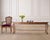 A charming weathered long walnut console or sofa table crafted in an English Queen Anne, or Country English style. The...