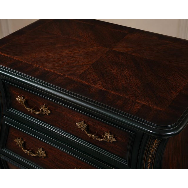 A dramatic reimagining of the classic Bombay chest, this three-drawer statement piece has been elevated into a richly...