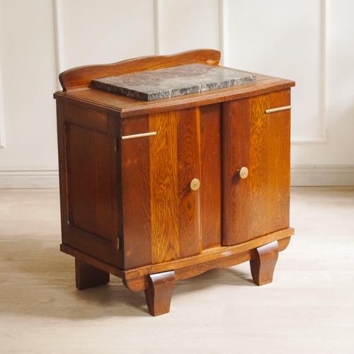 Historic oak nightstand with a marble top, stylistically dating to the period around 1925–1935 with Art Deco influences....