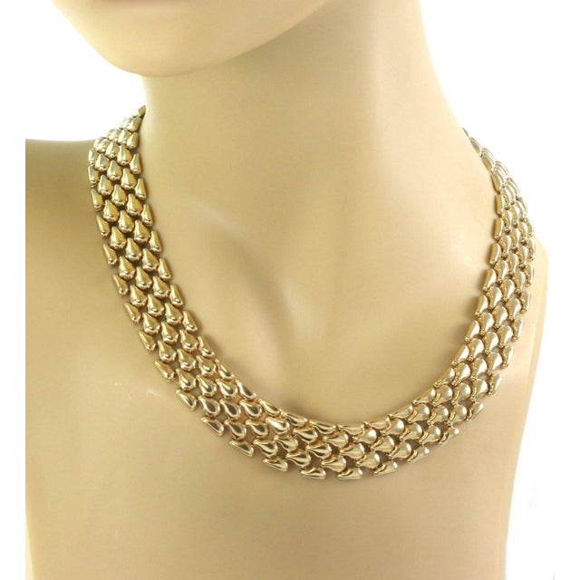 This is a beautiful wide collar necklace, it is crafted from 14k yellow gold featuring a 16.5mm wide form with flexible...