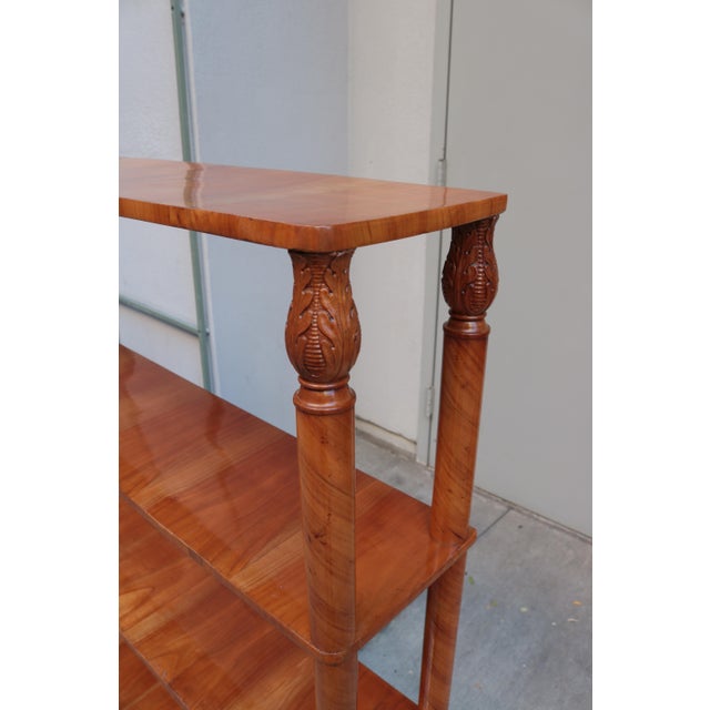 A fine free standing Biedermeier shelf. Cherrywood with carved details.