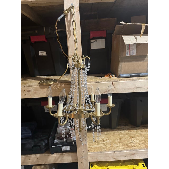 Visual comfort chandelier signature . Antique burnished brass.