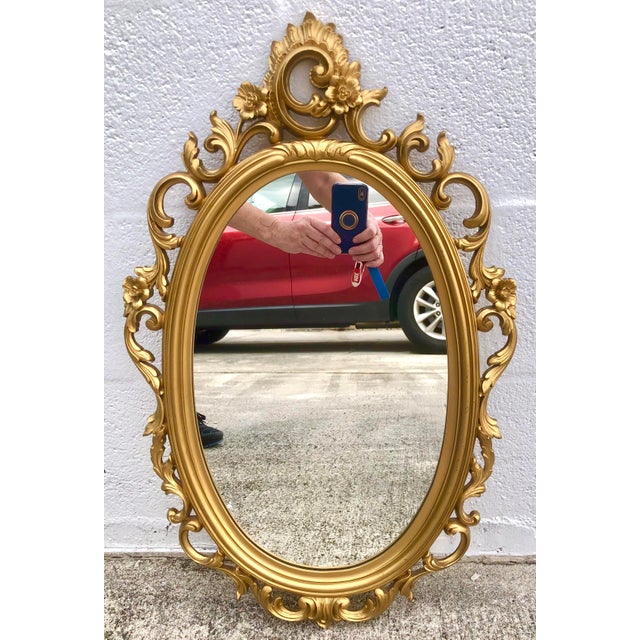 Beautiful vintage 1969 ornate gold syroco hanging wall mirror. Made in the USA by Syroco in 1969. Mrked as shown. Ready to...