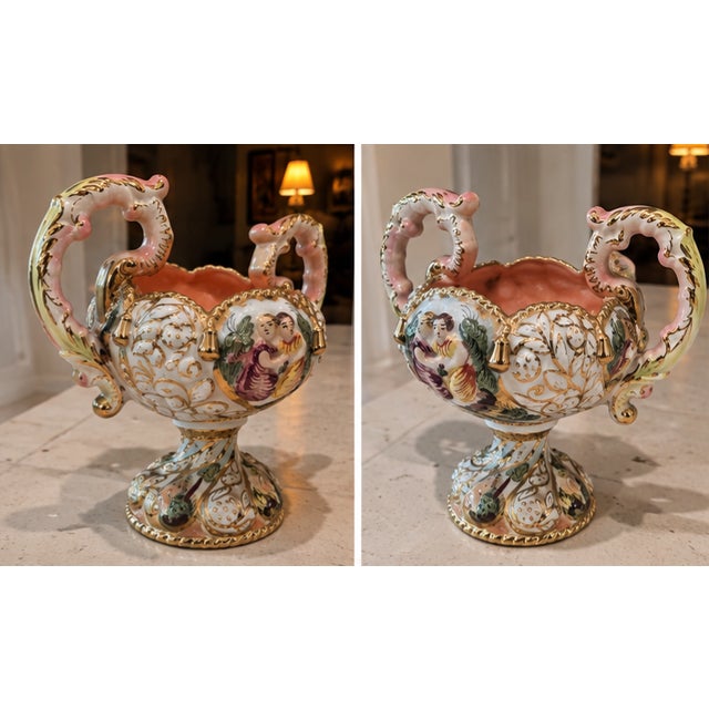 Ornate vintage Italian porcelain pedestal compote or centerpiece bowl featuring elaborate hand-painted decoration,...