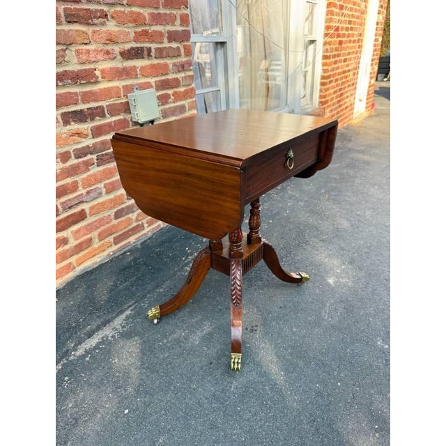 "Antique American Classical Style Duncan Phyfe Carved Mahogany Drop Leaf Side Table, It features rectangular top with...