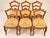 Set of six Louis-Philippe period chairs in stained fruitwood, with openwork backs featuring two carved crossbars decorated...
