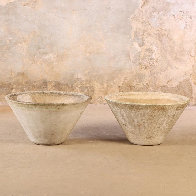 A stunning pair of hard-to-find models, these French cast stone round planters are attributed to Willy Guhl (1915–2004),...