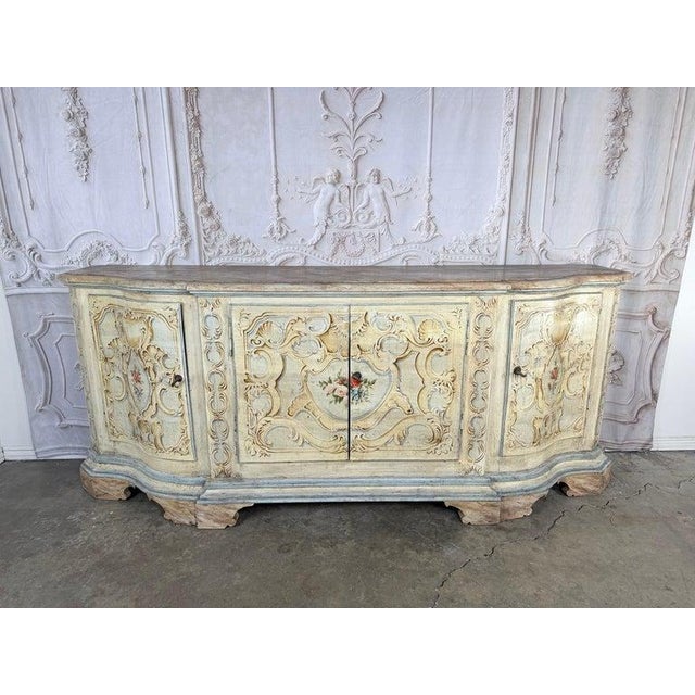 Magnificent Italian Rococo style credenza, a sculptural statement piece with incredible presence. This rare painted...