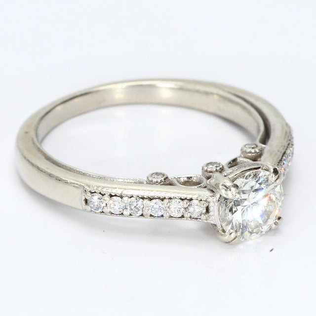 This is a 14k White Gold Engagement Ring with Diamond Accents. The primary stone is a 0.5 carat Brilliant-cut Diamond,...