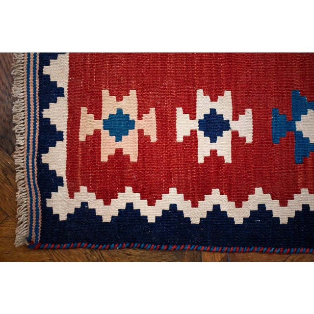 Hand-knotted Ghashghai kilim made of high-quality wool. The rug has a classic geometric decor with a distinctive color...